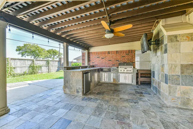 a view of a porch with a table and chairs
