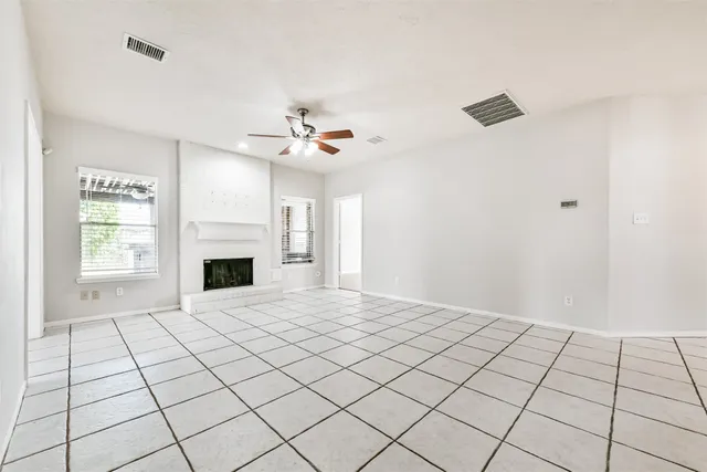 a view of an empty room with a fireplace