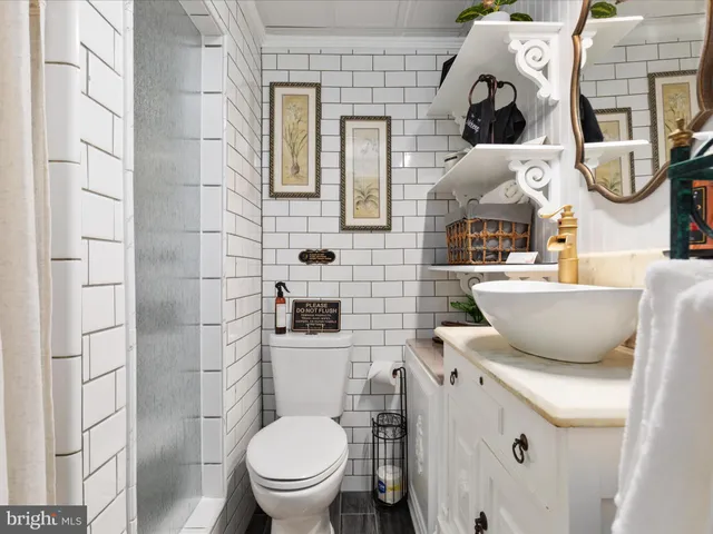 a bathroom with a toilet and shower