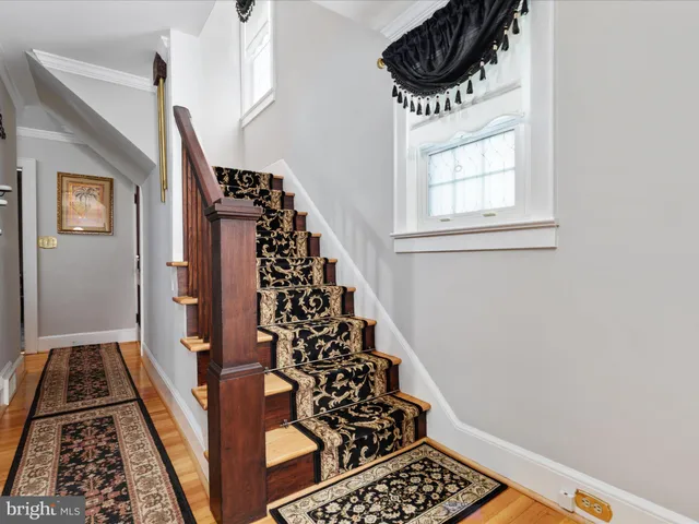 a view of a entryway door with wooden floor