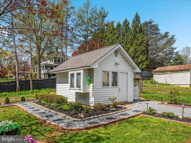 a view of a patio with couches and potted plants