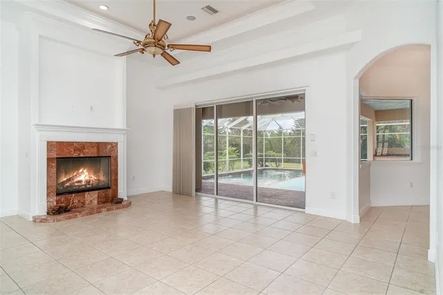 a view of a kitchen with refrigerator and a sink