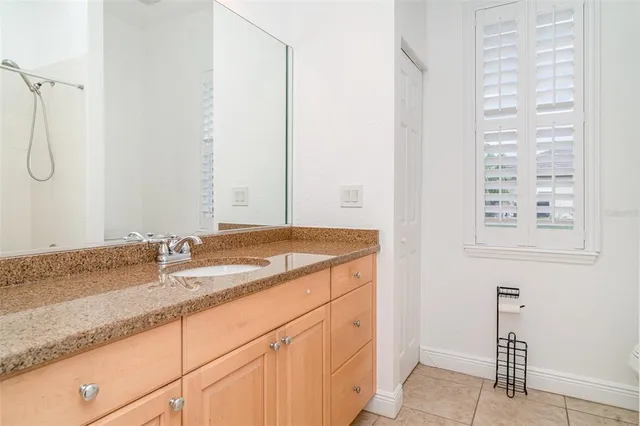 a backyard of a house with a yard and outdoor seating