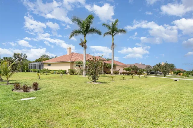 a view of a kitchen with a refrigerator and a sink