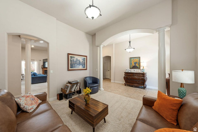 1609 East 10 S Street St. George, UT 84790 - Photo 11 of 68 Spacious room featuring archways and columns, recessed lighting, neutral wall paint, and beige carpeting
