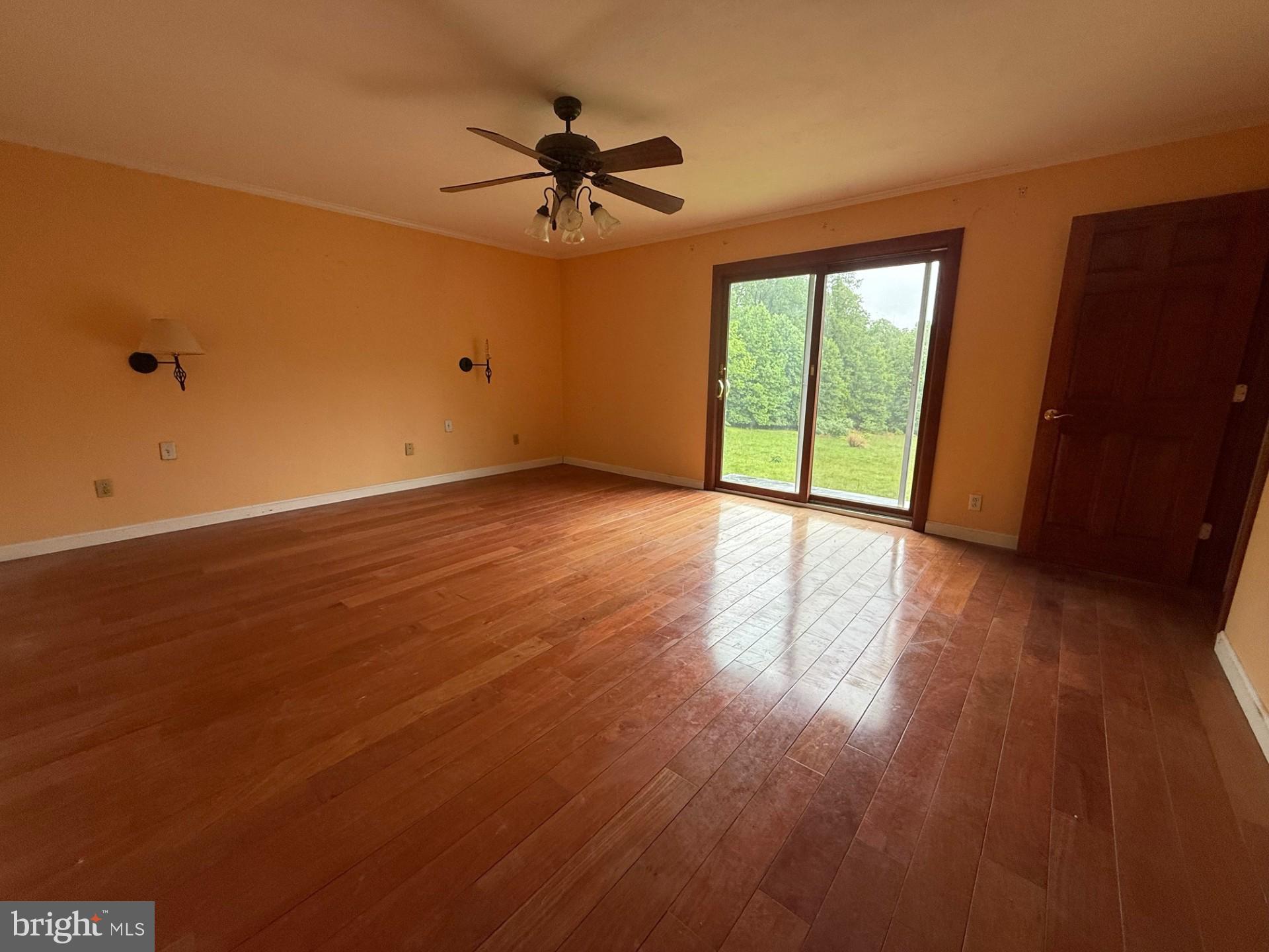 790 Hopewell Road Downingtown, PA 19335 - Photo 20 of 27 a view of an empty room with a window and wooden floor
