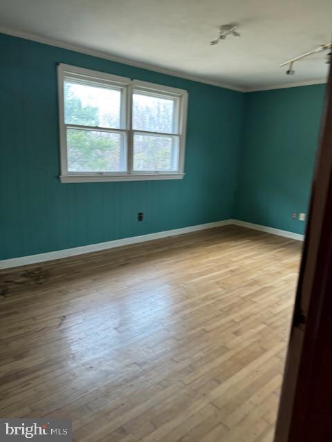 790 Hopewell Road Downingtown, PA 19335 - Photo 23 of 27 an empty room with wooden floor and windows