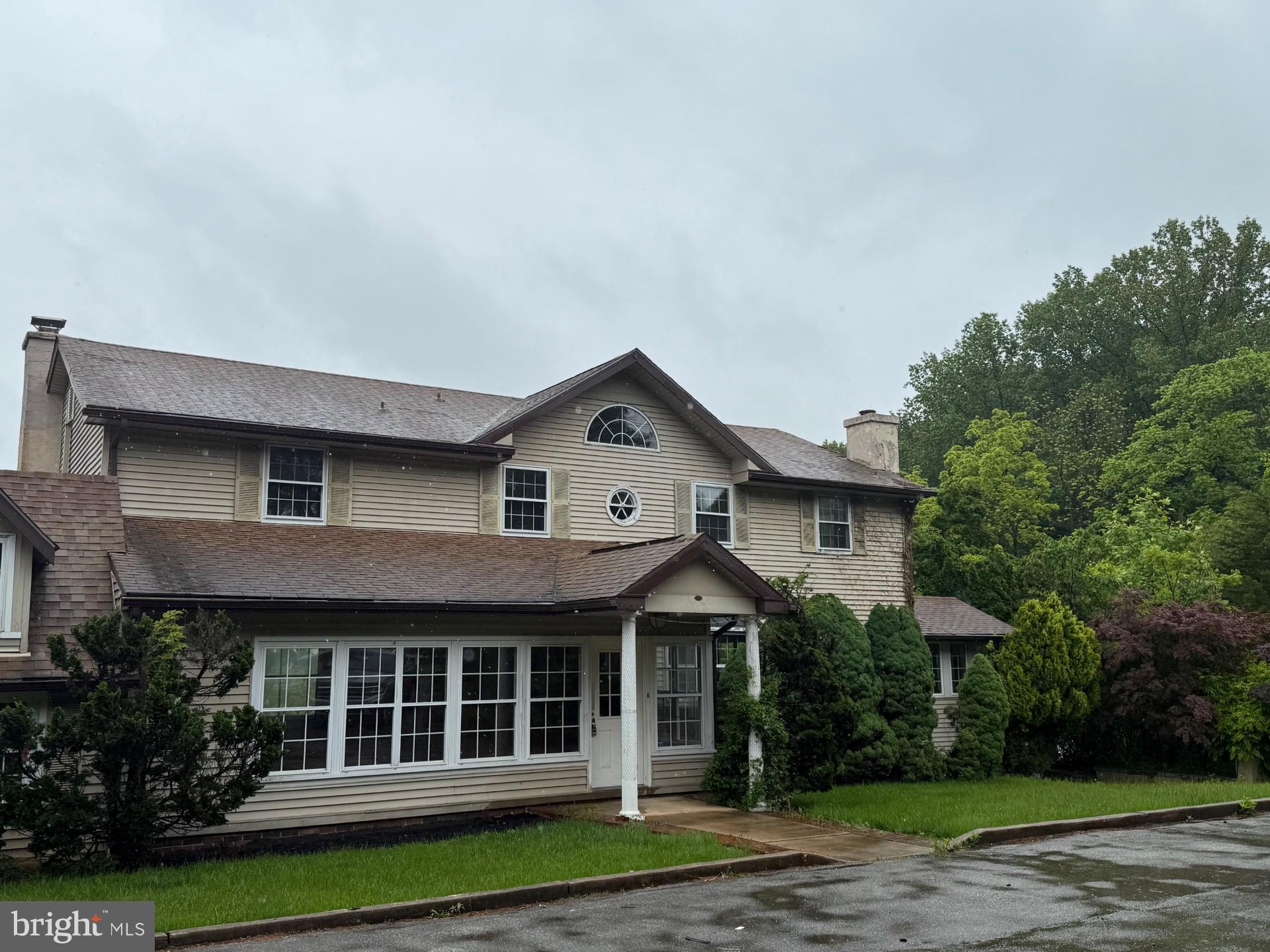 790 Hopewell Road Downingtown, PA 19335 - Photo 4 of 27 a house view with a garden space