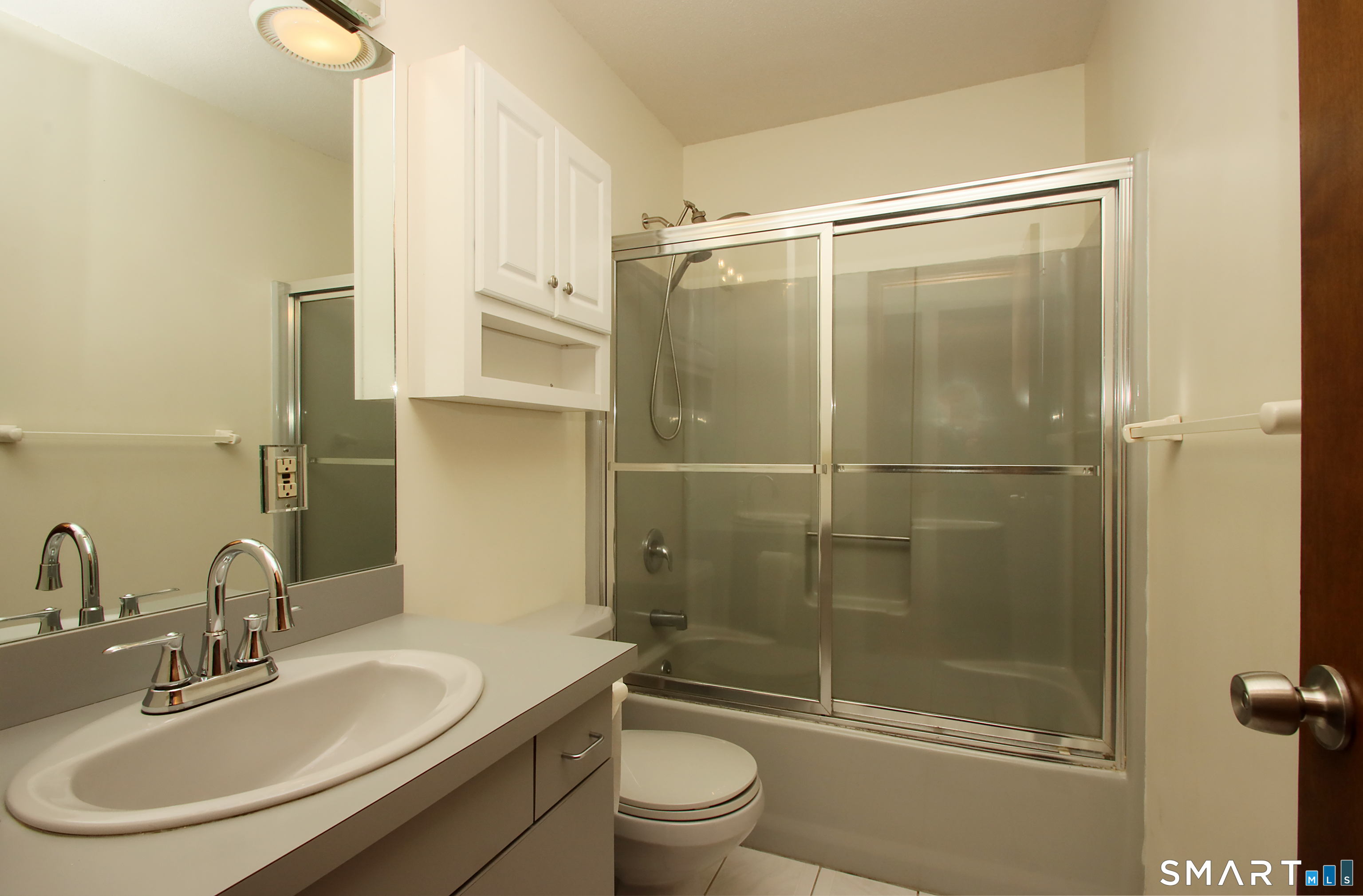 352 Center Street Wolcott, CT 06716 - Photo 28 of 40 a bathroom with a sink toilet and shower