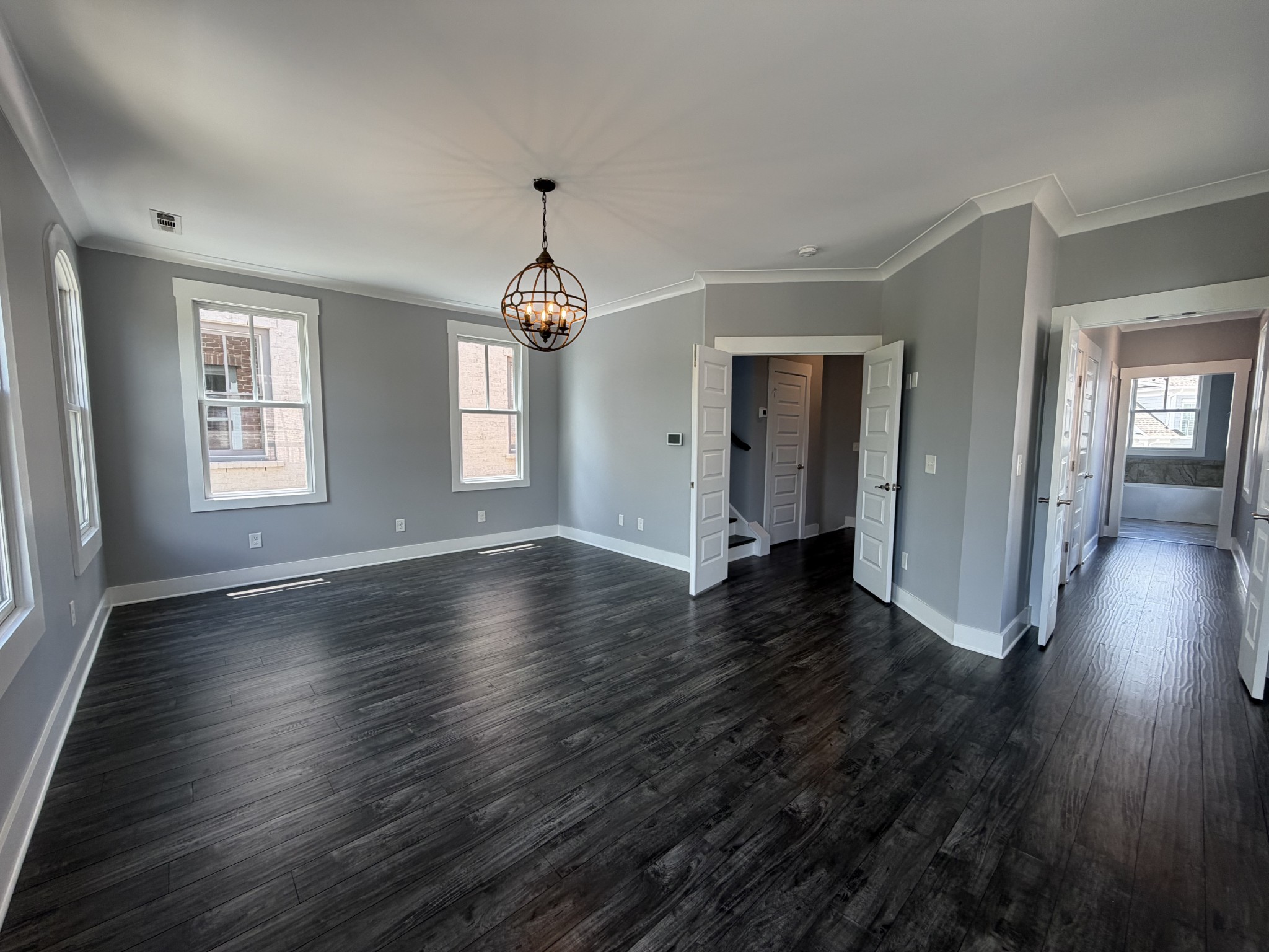 3097 Rural Plains Circle Franklin, TN 37064 - Photo 18 of 28 an empty room with wooden floor and windows