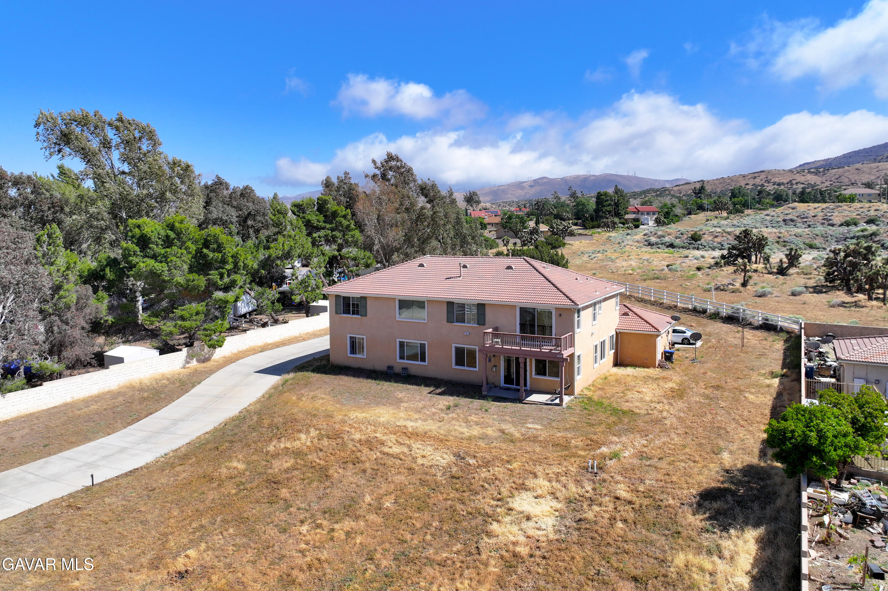658 Lago Lindo Road Palmdale, CA 93550 - Photo 87 of 91 a view of a house with a yard