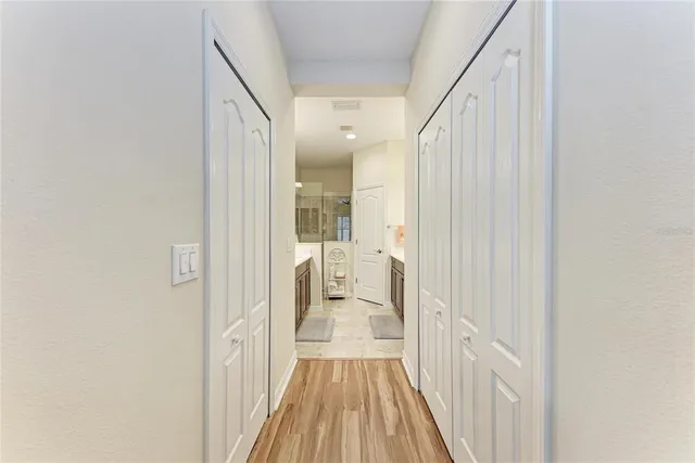 a view of a bathroom from a hallway