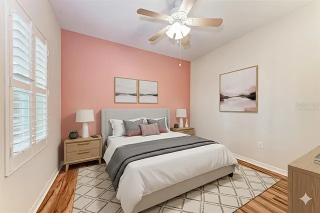 a bedroom with a large bed and a window