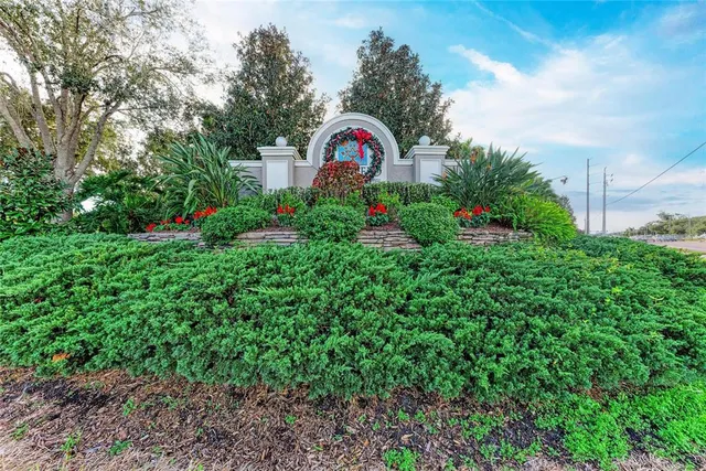 a view of a house with a backyard and garden