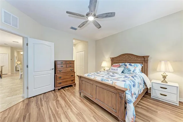 a bedroom with a bed and a dresser