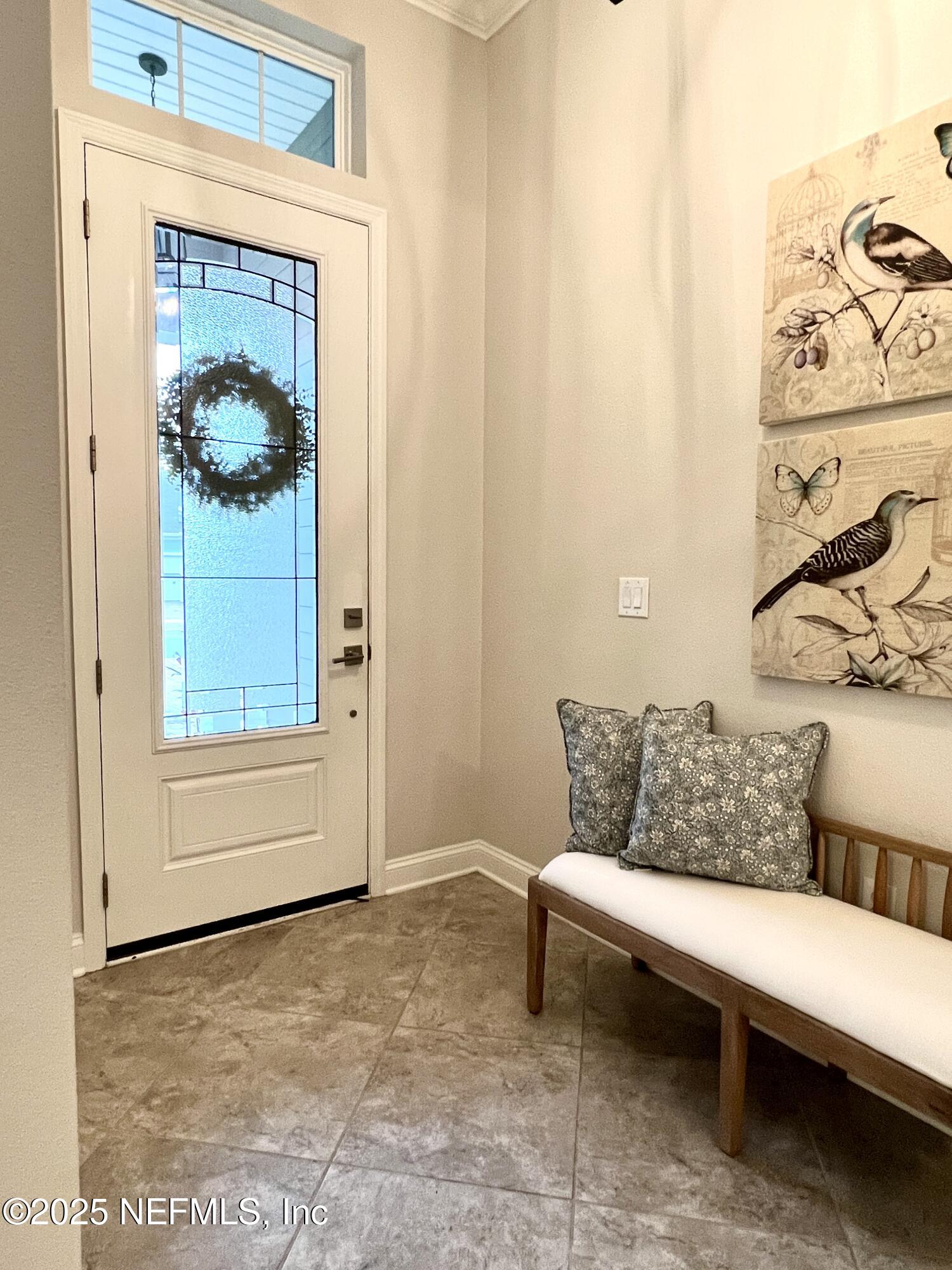 a living room with furniture and a painting