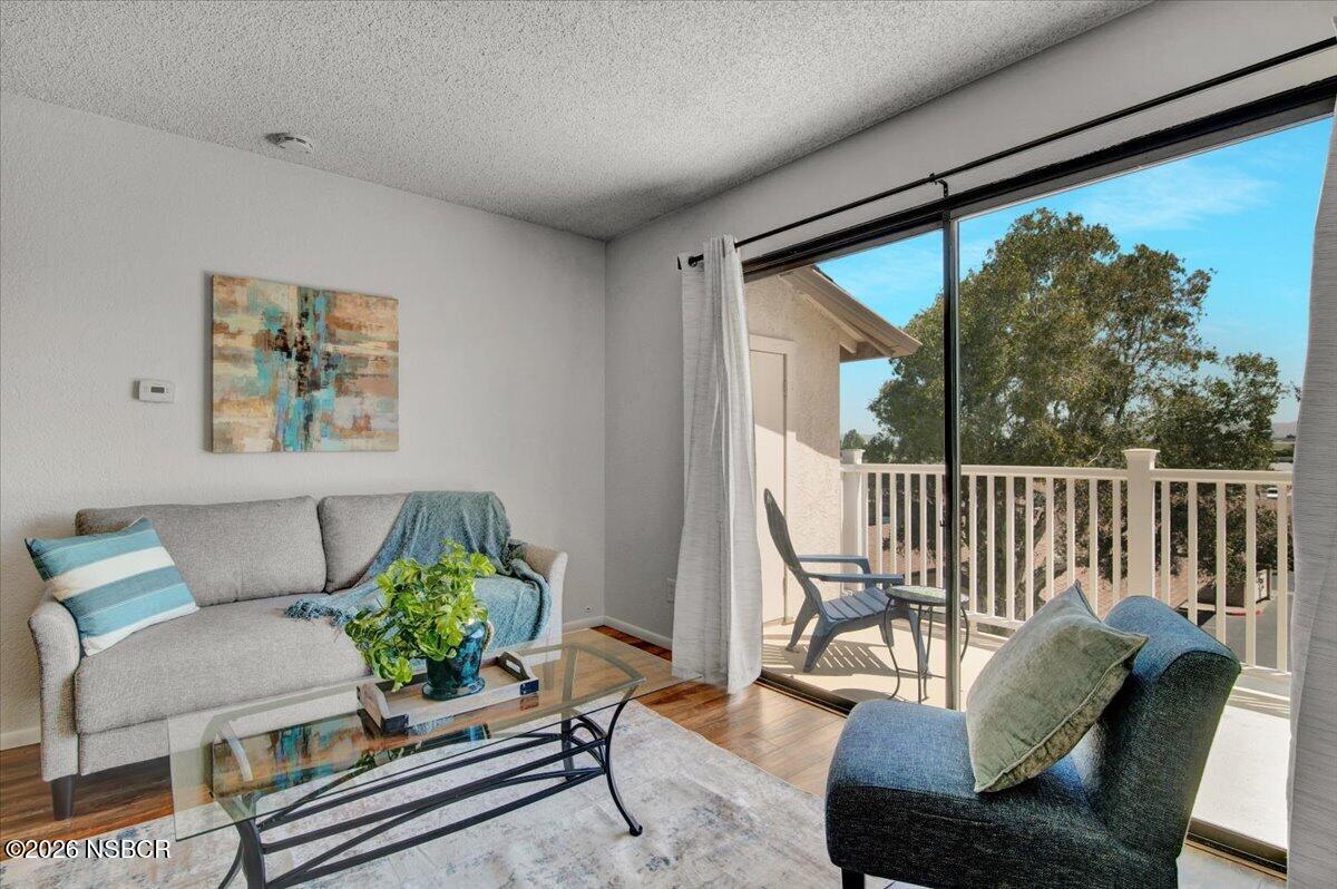 3400 Santa Maria Way, Unit 207B Santa Maria, CA 93455 - Photo 12 of 50 a living room with furniture and a potted plant