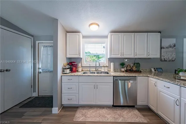 a backyard of a house with a yard and outdoor seating