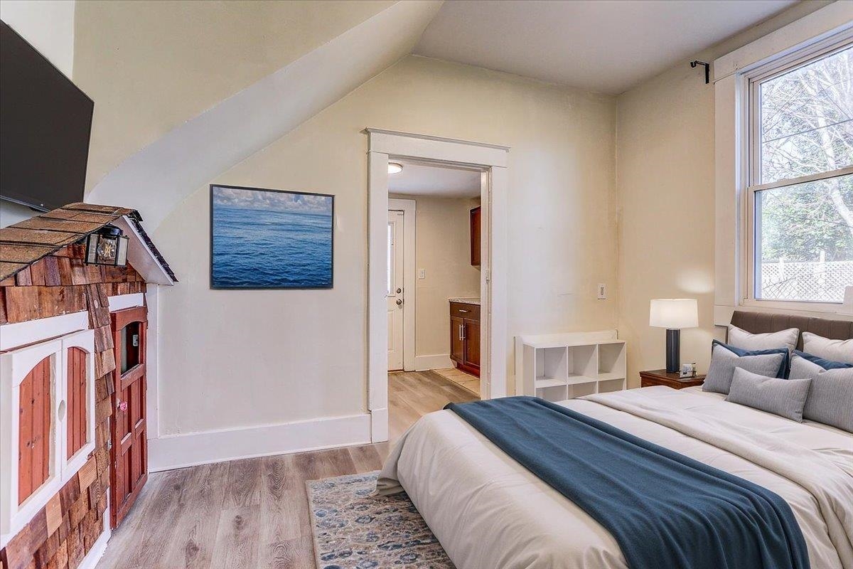 989 Bruce Street Memphis, TN 38104 - Photo 15 of 40 Bedroom featuring light wood-style flooring and ensuite bathroom