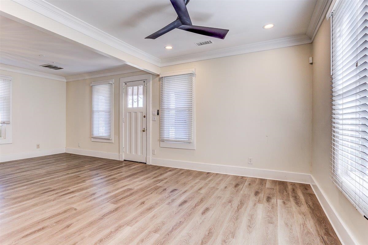 989 Bruce Street Memphis, TN 38104 - Photo 27 of 40 Foyer entrance with crown molding, light wood-style floors, a ceiling fan, and recessed lighting