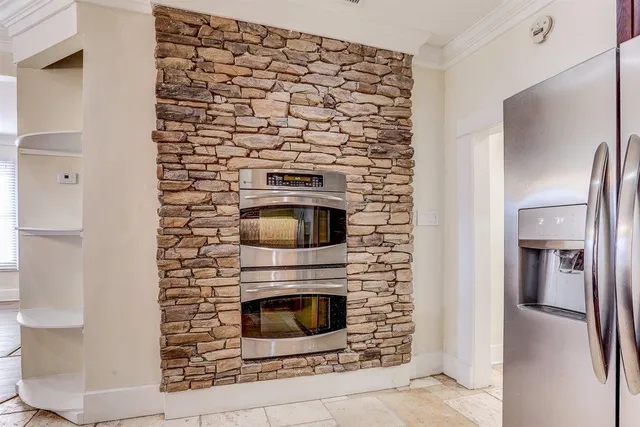 a spacious bedroom with a large bed and a window