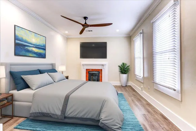 a living room with furniture a fireplace and a flat screen tv