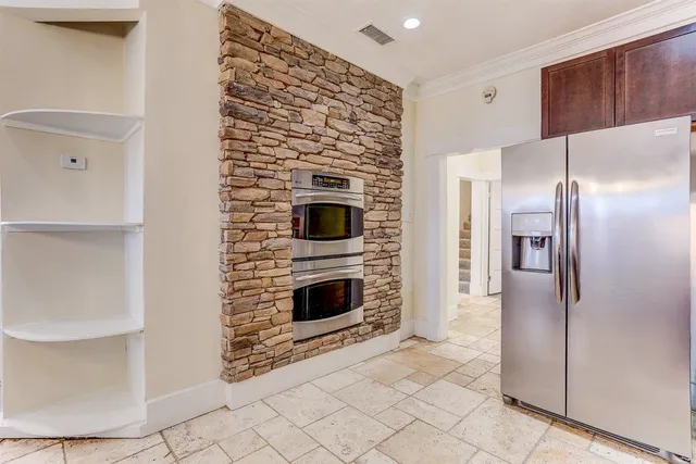 a kitchen with stainless steel appliances granite countertop a sink and stove