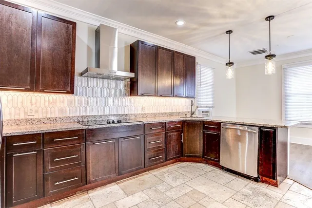 a kitchen with stainless steel appliances granite countertop a sink stove refrigerator and cabinets