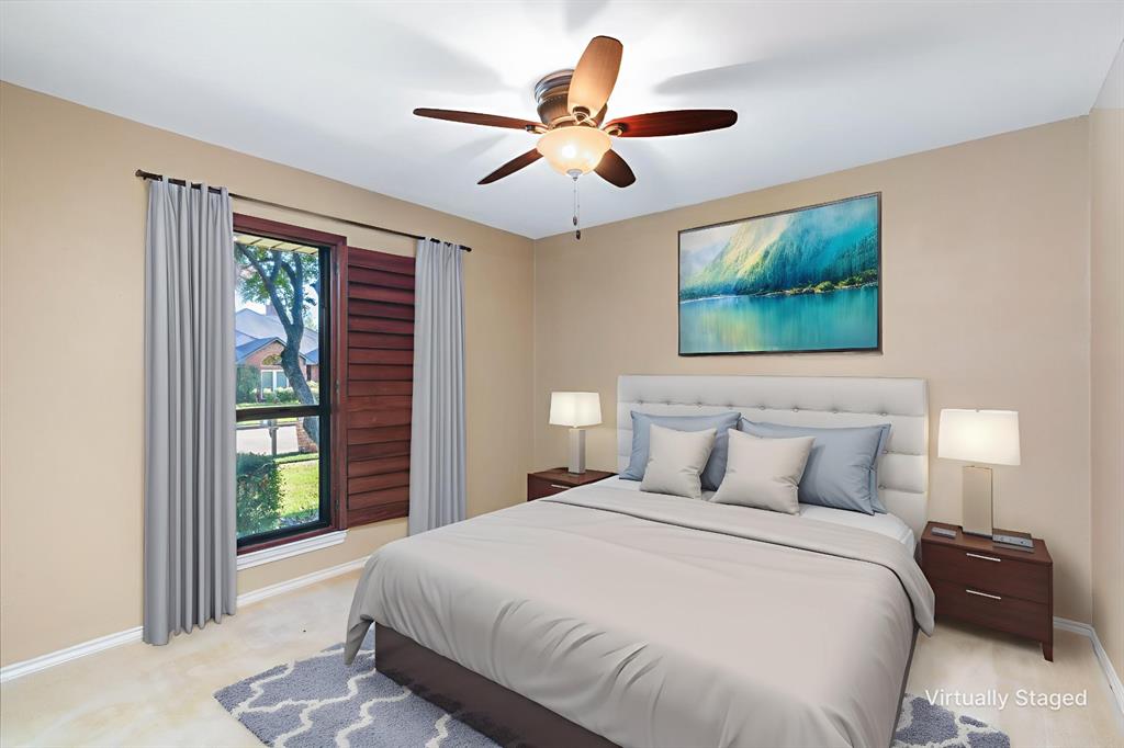 1106 Tahlequah Trail Carrollton, TX 75007 - Photo 14 of 20 a bedroom with a large bed and a large window