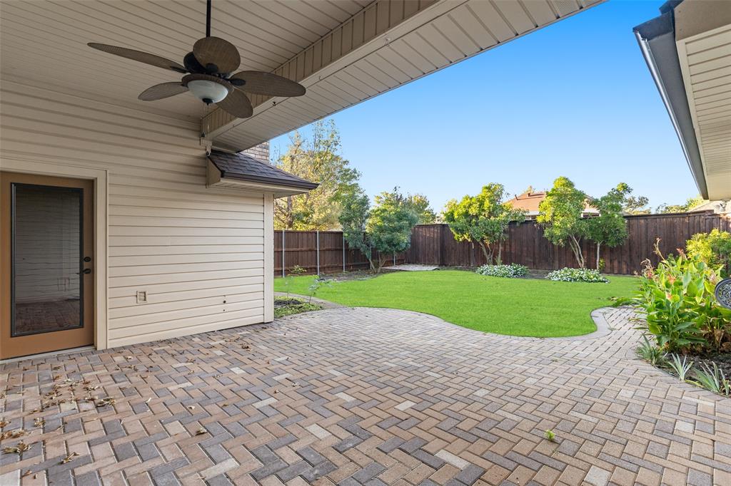 1106 Tahlequah Trail Carrollton, TX 75007 - Photo 17 of 20 a view of a backyard with a garden