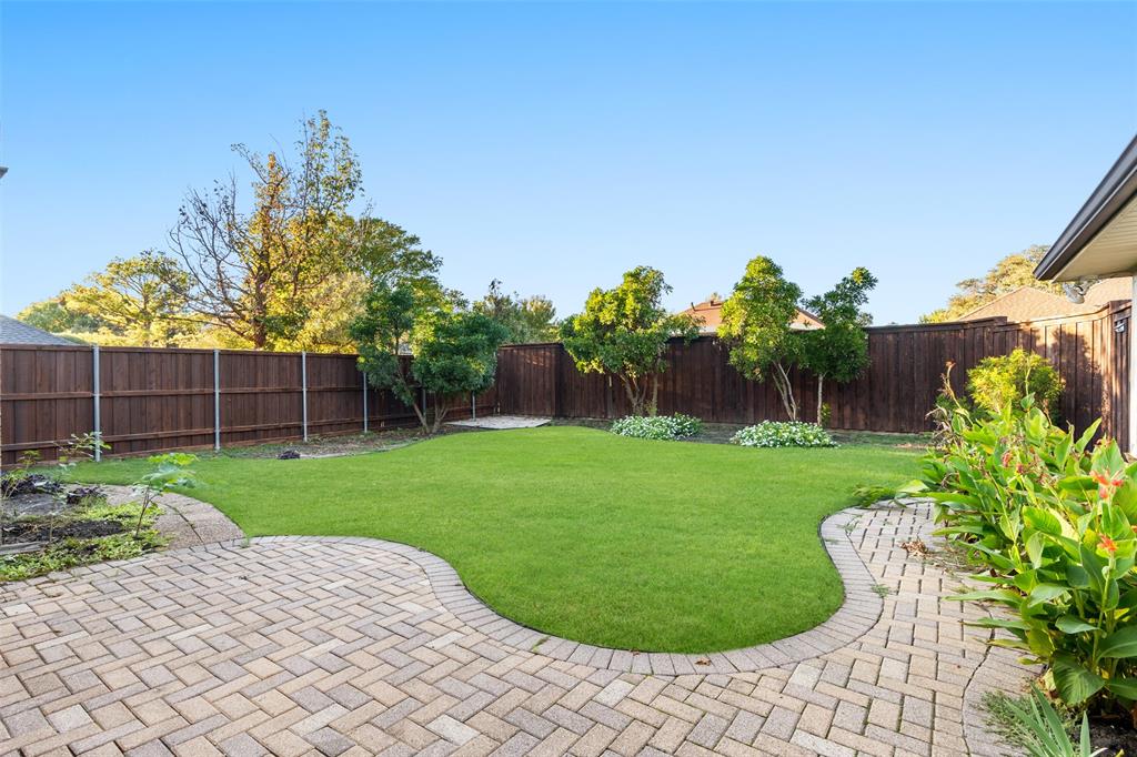 1106 Tahlequah Trail Carrollton, TX 75007 - Photo 18 of 20 a view of a backyard