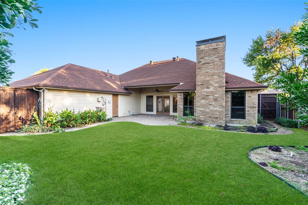 1106 Tahlequah Trail Carrollton, TX 75007 - Photo 20 of 20 a front view of a house with a yard