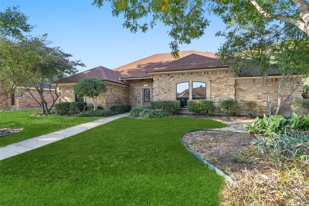 1106 Tahlequah Trail Carrollton, TX 75007 - Photo 2 of 20 a front view of a house with garden
