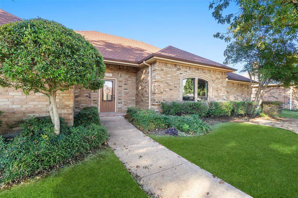 1106 Tahlequah Trail Carrollton, TX 75007 - Photo 3 of 20 a front view of a house with a yard