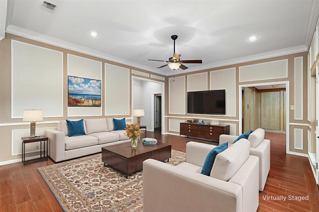 1106 Tahlequah Trail Carrollton, TX 75007 - Photo 5 of 20 a living room with furniture and a flat screen tv