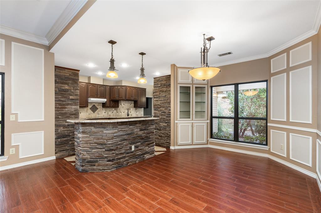 1106 Tahlequah Trail Carrollton, TX 75007 - Photo 6 of 20 a view of kitchen with furniture and wooden floor