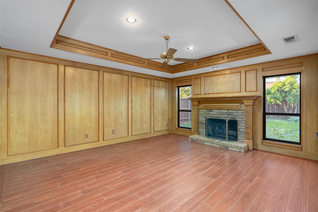 1106 Tahlequah Trail Carrollton, TX 75007 - Photo 10 of 20 a view of an empty room with a fireplace and a window