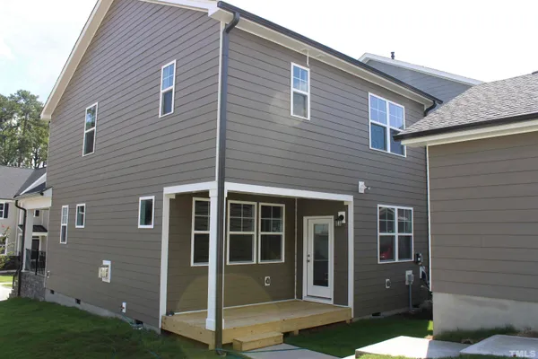 a view of a house with brick walls