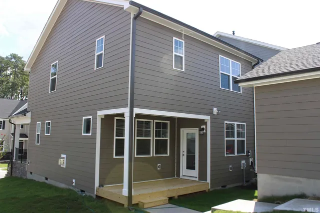 a view of a house with brick walls