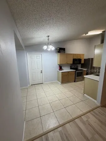 a large kitchen with cabinets
