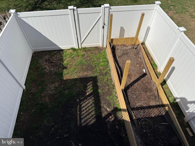 1008 Sithean Way Glen Burnie, MD 21060 - Photo 21 of 32 Inviting garden space awaits growth.