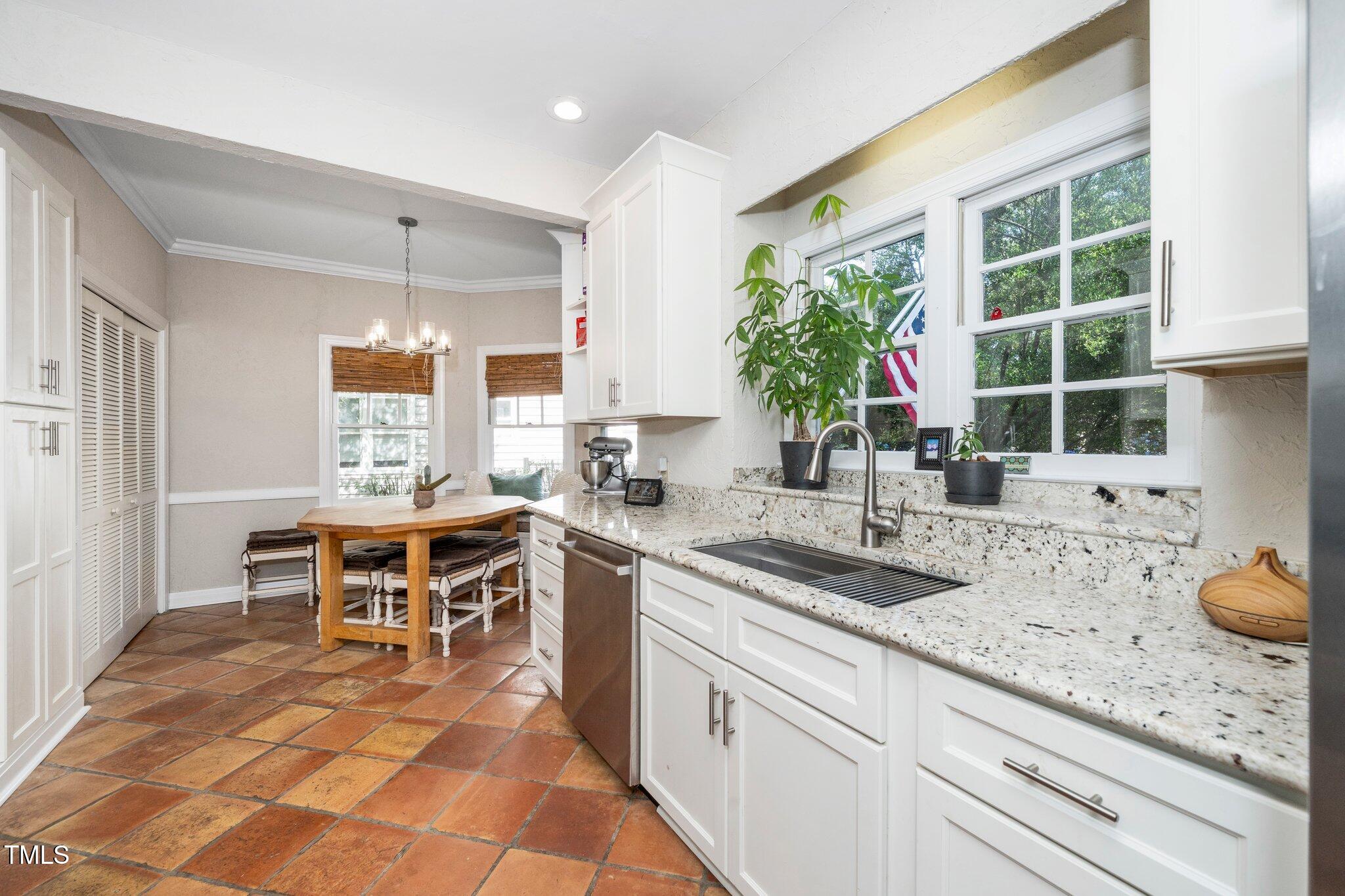 1712 Briarforest Place Raleigh, NC 27615 - Photo 8 of 55 Custom cabinetry is paired with beautiful granite countertops.
