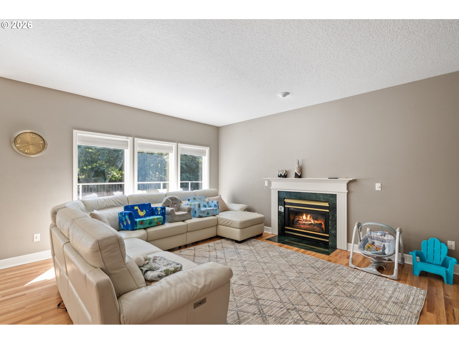4000 Southwest 30th Drive Gresham, OR 97080 - Photo 24 of 45 a living room with furniture a fireplace and a flat screen tv