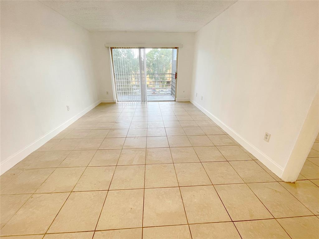 2800 Northwest 56th Avenue, Unit D402 Lauderhill, FL 33313 - Photo 3 of 14 a view of an empty room with a window