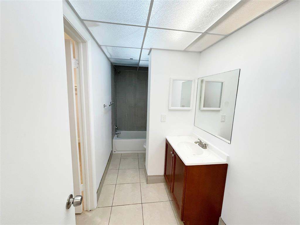 2800 Northwest 56th Avenue, Unit D402 Lauderhill, FL 33313 - Photo 8 of 14 a utility room with a sink dryer and washer