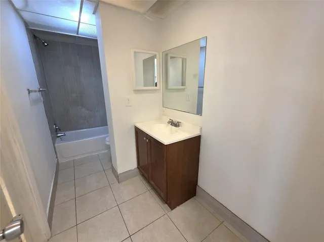 a bathroom with a bathtub and a toilet