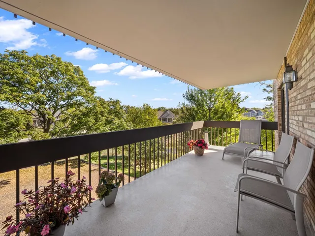 a view of balcony with furniture