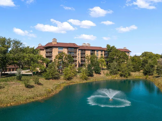 a view of a lake with a house in the background