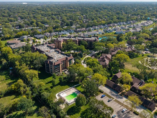 an aerial view of residential houses with city view