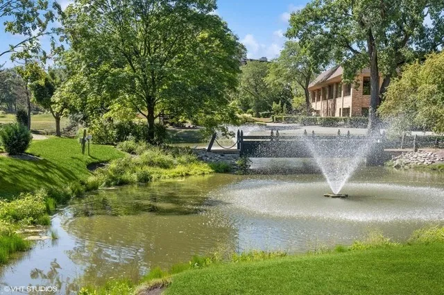 a view of swimming pool with a yard